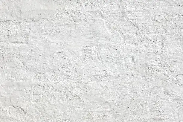Old  White Brick Wall. Plastered Brick Wall Or Fence. Solid Structure. Home House Interior Or Exterior. White Wash Surface. Abstract White Wallpaper. Design In Modern Vintage Style. Rustic Rough Bricklaying.