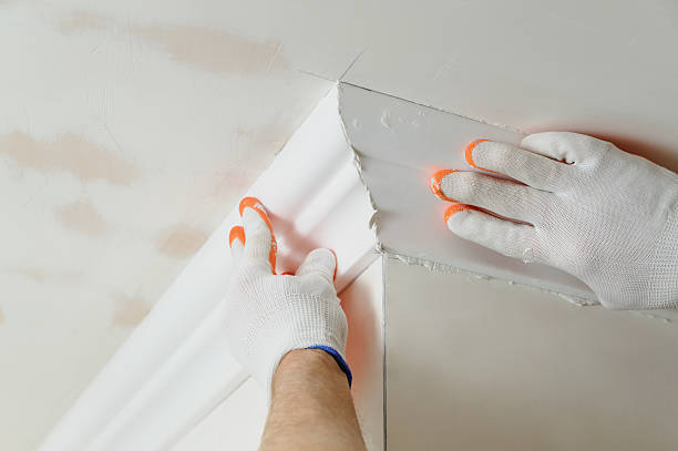 istock Installation of ceiling moldings. 625881348