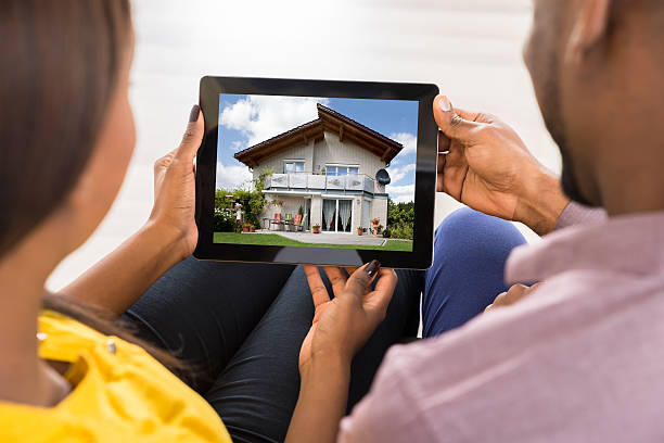 istock Couple Looking At House 625881370