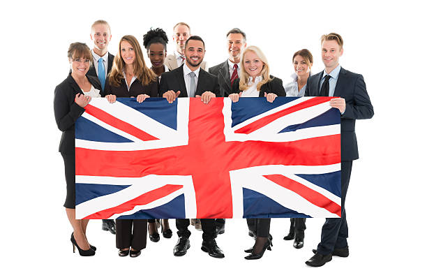 istock Happy Businesspeople Holding Union Jack 625881398