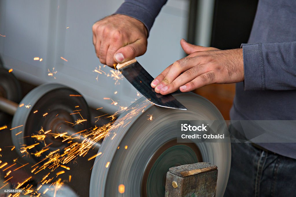 Sharpening the knife. Table Knife Stock Photo