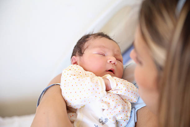 new born baby con su madre - cesarean fotografías e imágenes de stock