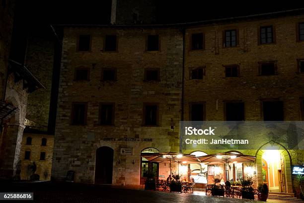 Buildings At Night In San Gimignano City In Italy Stock Photo - Download Image Now - Architecture, Black Color, Building Exterior