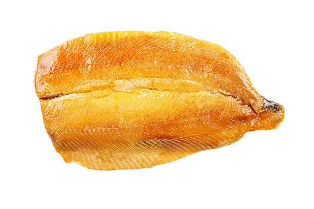 scottish kipper fillet, isolated on white smoked scottish kipper fillet, isolated on white background kipper stock pictures, royalty-free photos & images