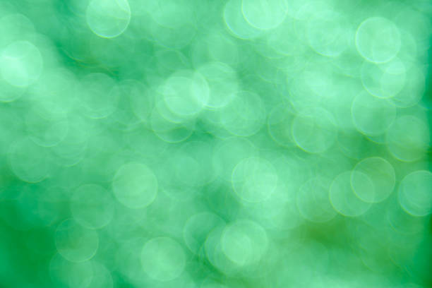 istock Green bokeh background created by neon lights 625888416