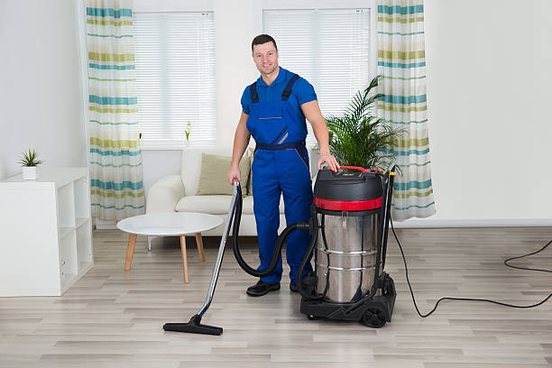 istock Worker Cleaning Floor With Vacuum Cleaner At Home 625888442