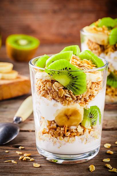 istock Healthy breakfast: yogurt parfait with granola, banana and kiwi 625888982