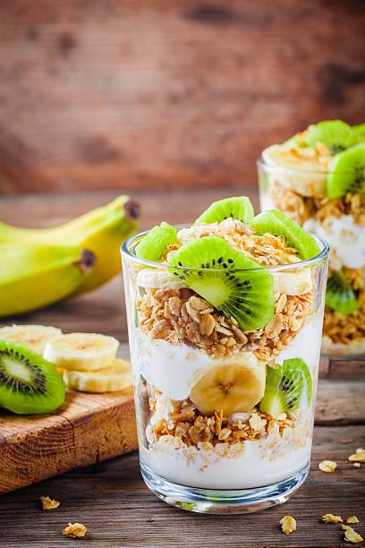 istock Healthy breakfast: yogurt parfait with granola, banana and kiwi 625889082