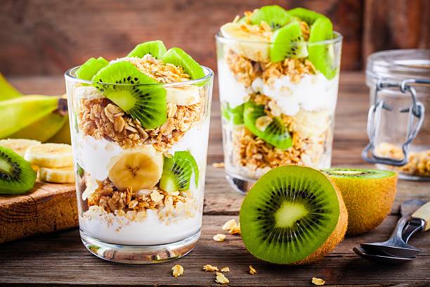 istock Healthy breakfast: yogurt parfait with granola, banana and kiwi 625889130