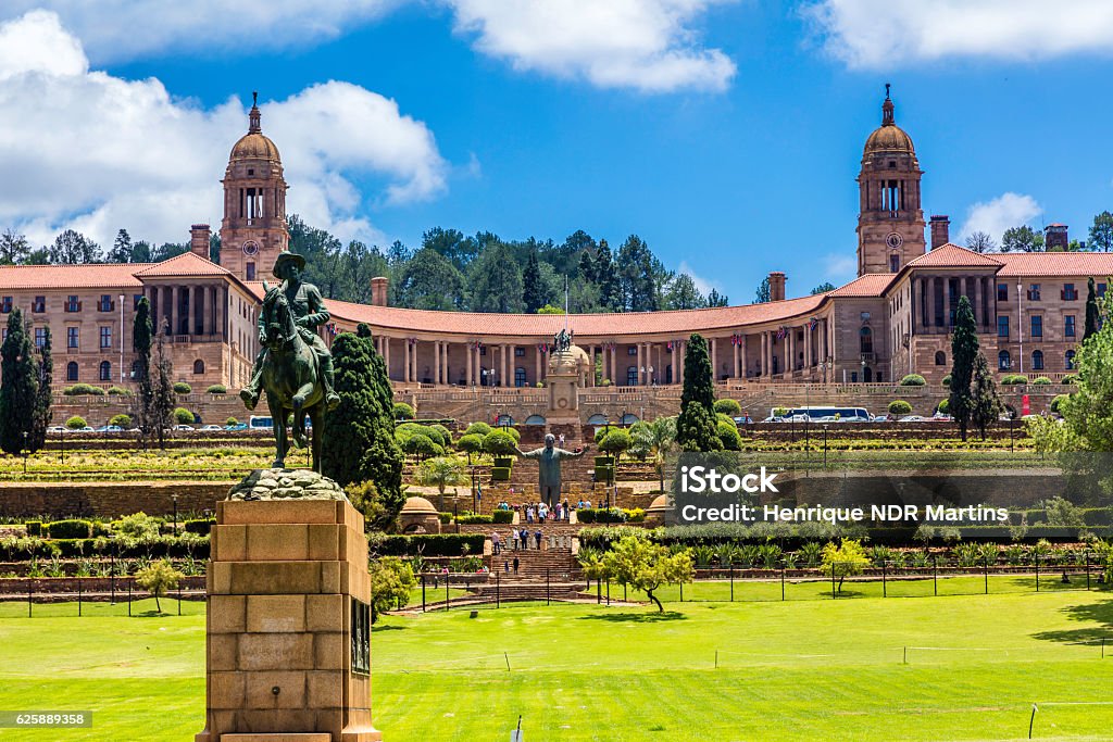 The Union Buildings in Pretoria, South Africa The Union Buildings and gardens in Pretoria, South Africa. This is where parliament is held in South Africa every six months alternatively with Cape Town. Tourists can be seen around Nelson Mandela statue in the centre. Pretoria Stock Photo