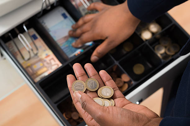 person's hand with euro note over container - cash register coin cash box checkout counter imagens e fotografias de stock