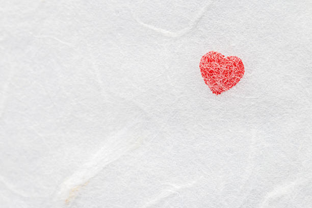 istock Red heart on white mulberry paper. 625889812