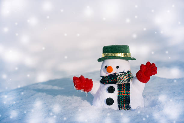 istock Snowman stand among pile of snow. 625890330