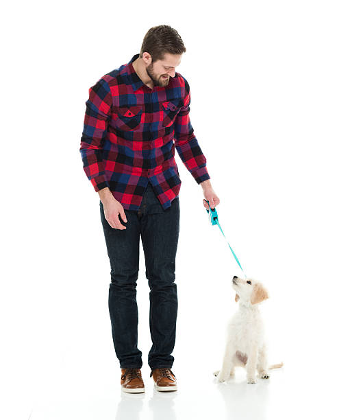 istock Smiling man holding his dog 625891280