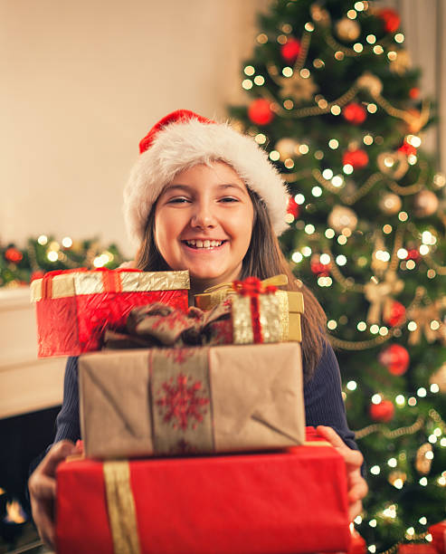 istock Happy little girl with Christmas present 625891532