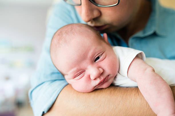istock Close up, unrecognizable father holding his newborn baby son 625892268