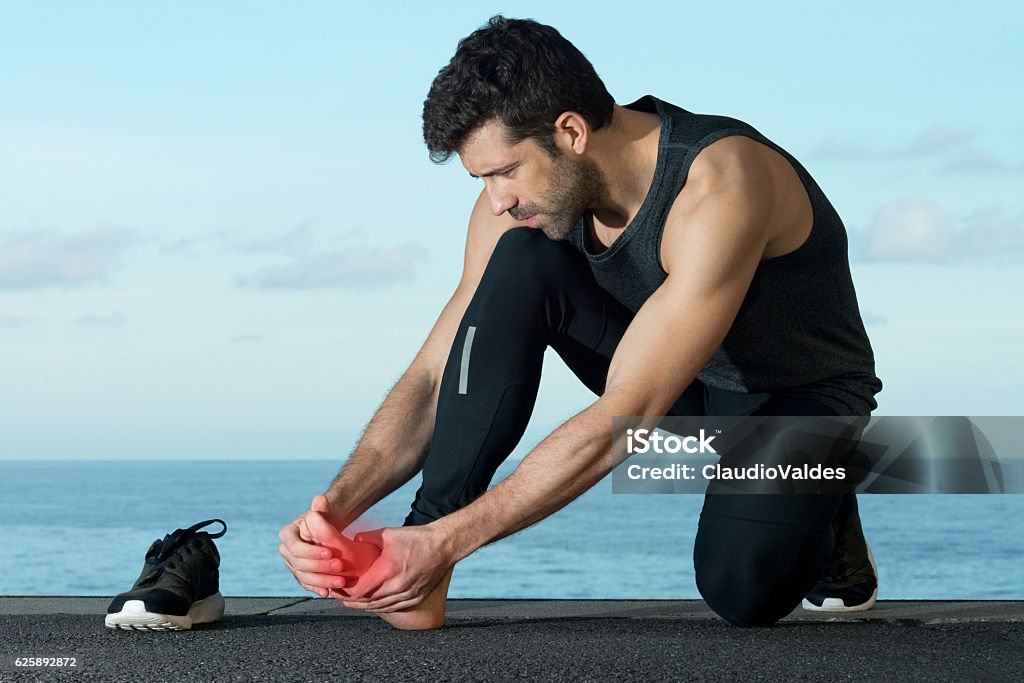 Athlete with foot injury Bone Fracture Stock Photo