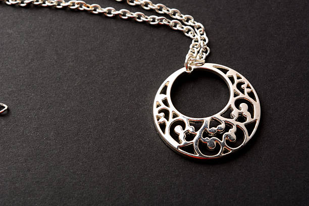 istock metal jewelry on dark background 625892874