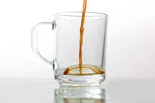 istock black coffee is poured in a transparent mug 625893172