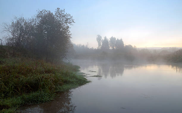 istock Misty autumn landscape with river 625893378
