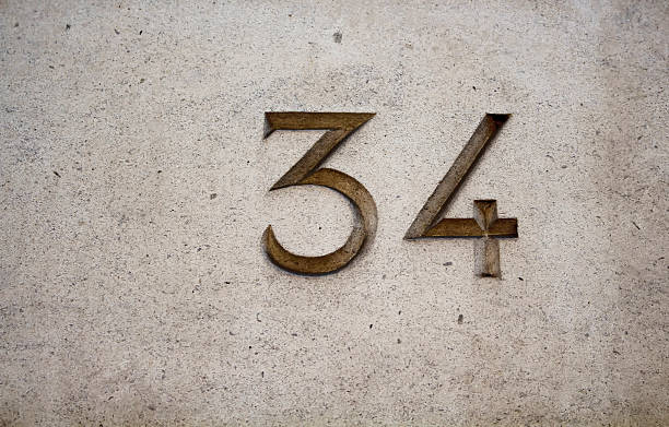 istock View of engraved building number (34) 625894318