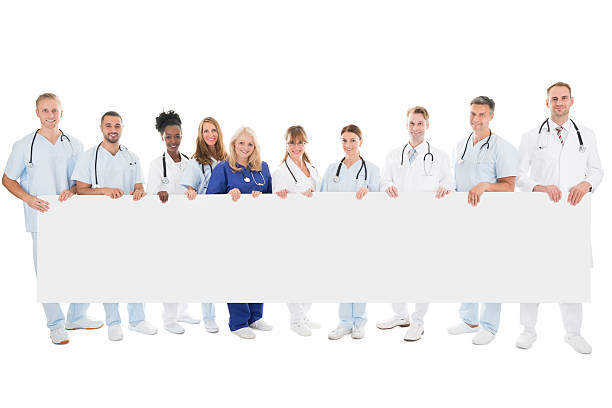 istock Confident Multiethnic Medical Team Holding Blank Billboard 625895372