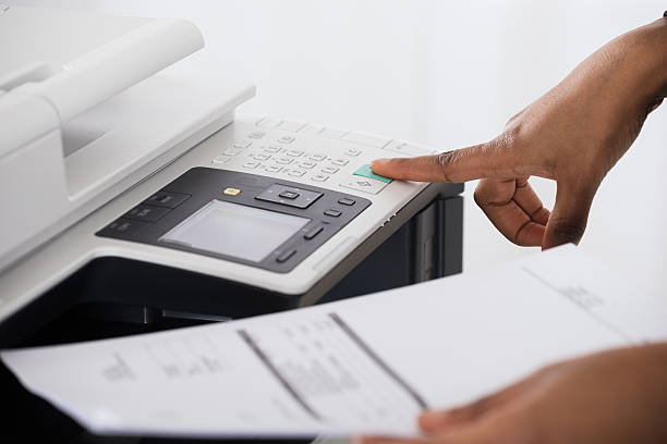 istock Businesswoman Operating Printer In Office 625895702