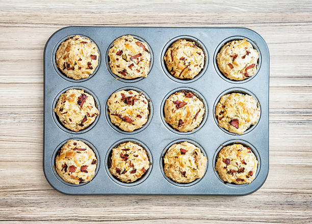 istock Tasty muffins stuffed with ham and cheese on the tray 625896090