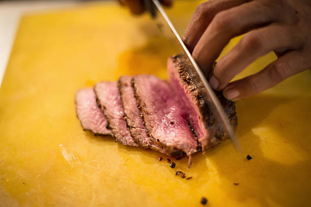 istock Roast beef on cutting board and knife. 625896144