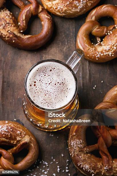 Lager Beer With Pretzels Stock Photo - Download Image Now - Baked Pastry Item, Bakery, Beer Festival