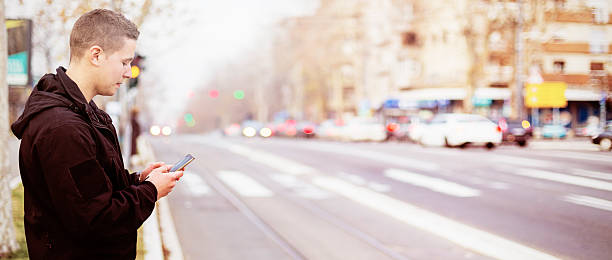 istock Men with smartphone on the street 625896526