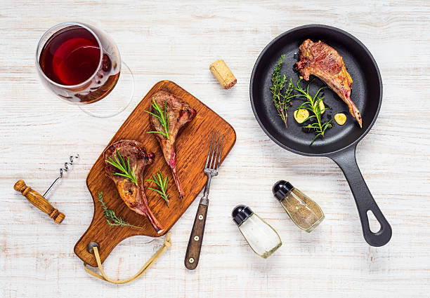 istock Grilled Lamb Chops with Red Wine and Frying Pan 625896890