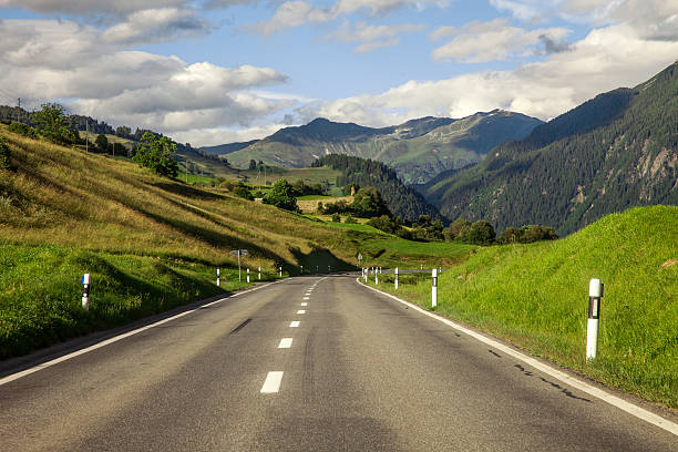 mountain road near tarasp, switzerland - castle engadine alps lake water imagens e fotografias de stock