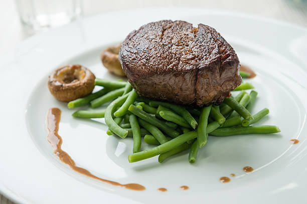 istock Beef steak with green beans and mushrooms 625902832