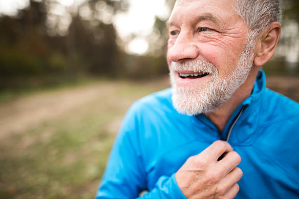 istock Senior runner in nature. Man resting, smiling. Close up. 625903214