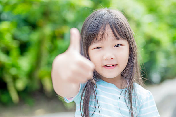 istock girl smile happily in park 625903374