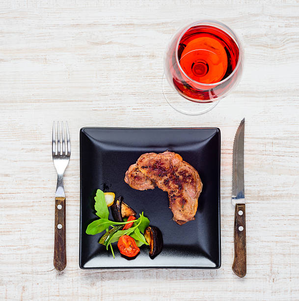 istock Steak with Rose Wine in Top View 625903818