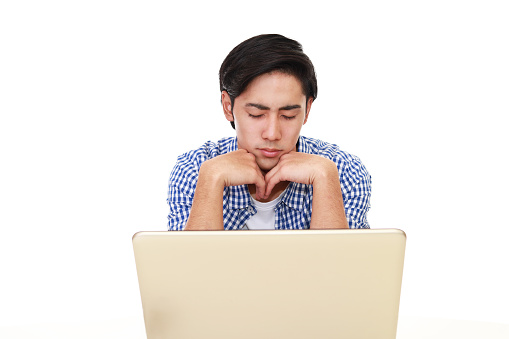 Stress Asian man with a laptop.