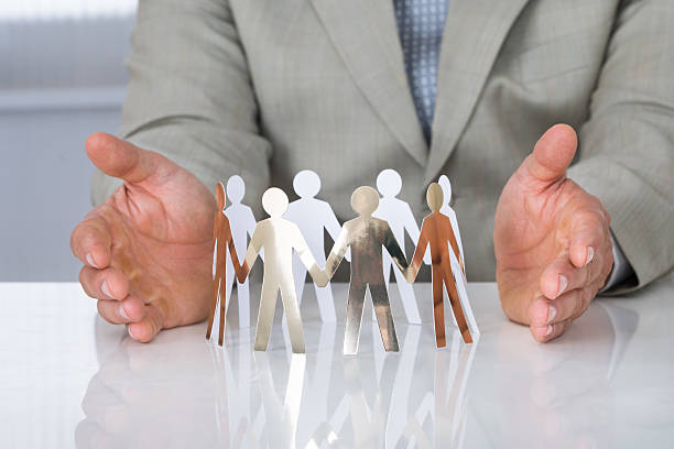 istock Businessman Protecting Paper Team On Desk 625904698
