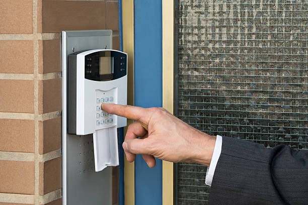 istock Close-up Of Businessperson Entering Code In Security System 625904808