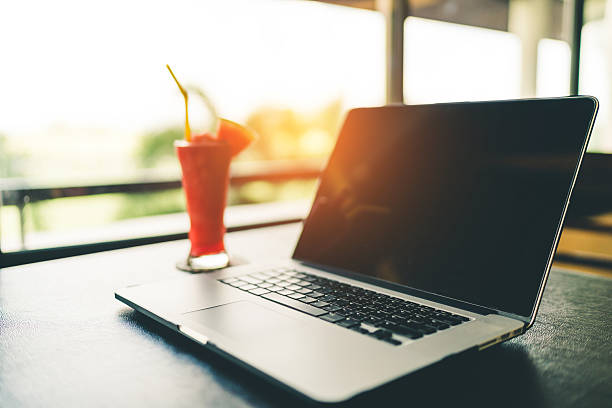 Laptop on garden background, slow life or freelance concept