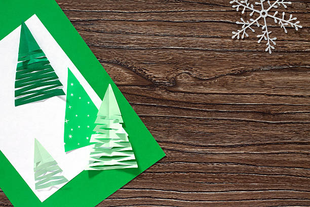 istock Christmas frame. The child makes paper fir tree. 625906310