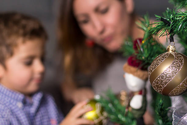 istock Mother and son decorating Christmas tree 625906478