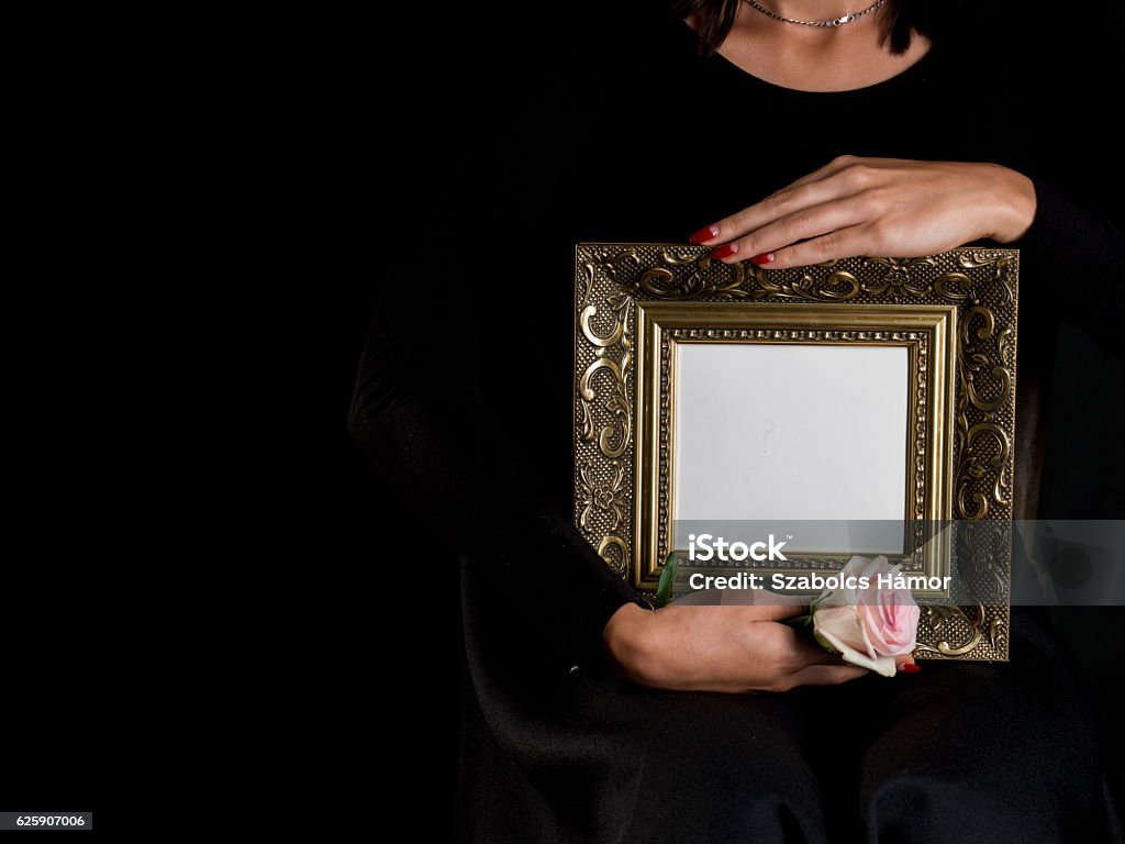 woman hold blank mourning frame with flower woman outflank blank mourning frame with sympathy flower Adult Stock Photo