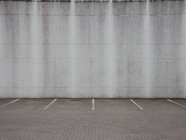 istock Empty Grey Urban Ghetto Parking Lot with Wall 625908748