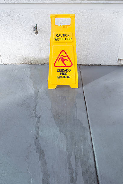 istock Slippery floor surface warning sign and symbol in building, hall 625909464