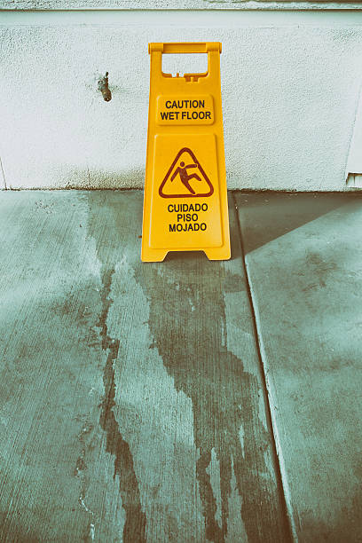 istock Slippery floor surface warning sign and symbol in building, hall 625909616
