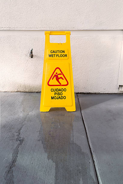 istock Slippery floor surface warning sign and symbol in building, hall 625909724