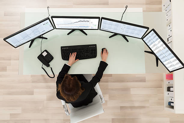 istock Female Stock Market Broker Looking At Graphs 625911862