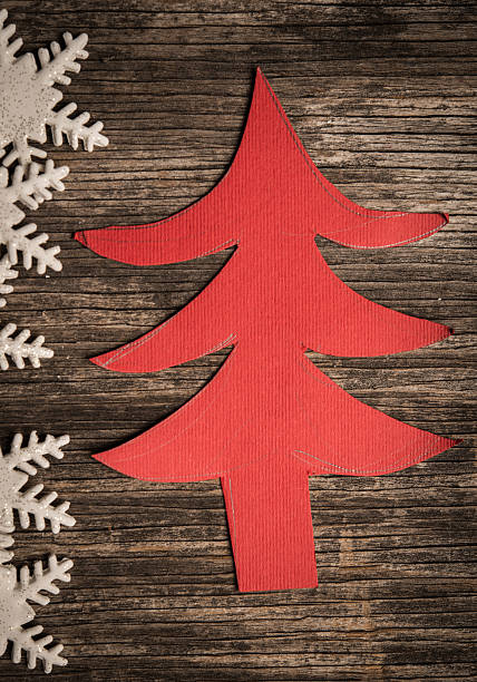 istock Christmas tree cut out from paper on a wooden background 625912426